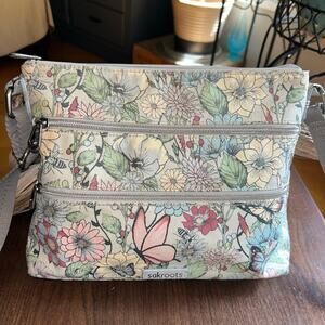 A Sakroots Artist Circle Basic Crossbody Bag Adjustable Strap butterfly floral